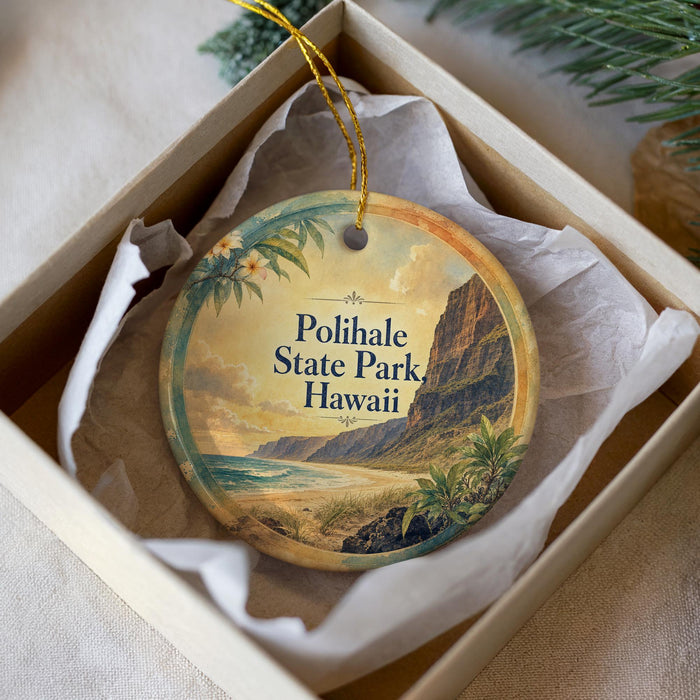 A decorative ornament in a box, featuring a tropical landscape with palm trees and mountains, along with the text "Polihale State Park Hawaii".