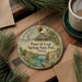 A decorative ornament featuring a scenic image of Ponce de Leon Springs State Park in Florida, with a small statue of a man in the background.