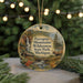 A decorative ornament featuring a scenic landscape with a waterfall, moose, and cabin, with the text "Porcupine Mountains Wilderness State Park, Michigan" displayed prominently.