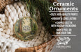 Ceramic ornaments, featuring a forest scene, are displayed in a basket.