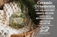 Ceramic ornaments, featuring a detailed illustration of Potato Creek State Park, Indiana, hanging from a wicker basket.