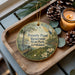 A wooden tray with a decorative ornament featuring a scenic landscape of Louisiana, including a pond, trees, and wildlife. The ornament also displays the text "Poverty Point Reservoir State Park, Louisiana".