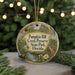 A round ornament with a picture of a forest and the text "Pumpkin Hill Creek Preserve State Park, Florida" hanging from a string.