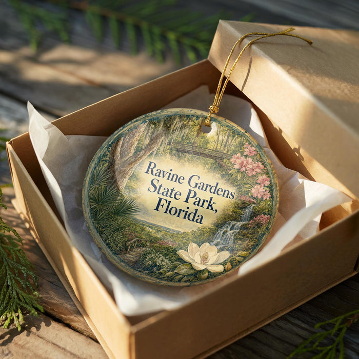 An ornamental ornament in a brown box, featuring a scenic image of Ravine Gardens State Park, Florida.