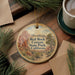 A circular ornament with a scenic image of the Red Rock Canyon State Park in California, featuring a mountain landscape and a path leading through the park.