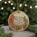 A circular ornament with a scenic image of the Red Rock Canyon State Park in California, featuring a mountain landscape and a path leading through the park.