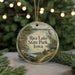 A round ornament with a scenic illustration of Rice Lake, State Park, Iowa, featuring a boat, a bird, and a path leading to a house.