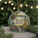 A decorative ornament featuring a scenic landscape of Rice Lake State Park in Minnesota, with a bird and flowers in the foreground.