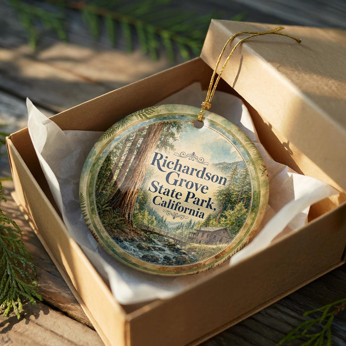 An oval ornament in a brown box, featuring a scenic image of a forest and a stream, with the text "Richardson Grove State Park, California" printed on it.