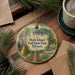 A decorative ornament featuring a scenic image of Rock Island Trail State Park in Illinois, with a bridge and a path leading through the landscape.