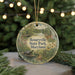 A round ornament with a scenic image of Rosaryville State Park, Maryland, featuring a turtle, deer, and flowers, surrounded by greenery and a string of lights.