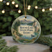 A round ornament with a scenic landscape of Round Lake State Park, Idaho, featuring a lake, mountains, and a duck swimming in the water.