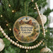 A round ornament hanging on a Christmas tree, featuring a scenic image of the Rocky Mountains and the words "Roxborough State Park, Colorado".
