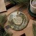 A round ornament with a scenic landscape of Russian Gulch State Park, California, featuring a waterfall and pine trees.