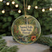 A round ornament with a tropical forest scene and a waterfall, featuring the text "Sacred Falls State Park, Hawaii".