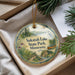 A decorative ornament with a scenic landscape of Sakatah Lake State Park, Minnesota, featuring a canoe and pine trees.