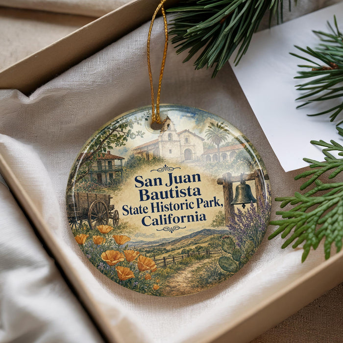 A decorative ornament with a picture of Santa Juan Bautista State Historic Park, California, hanging from a string.