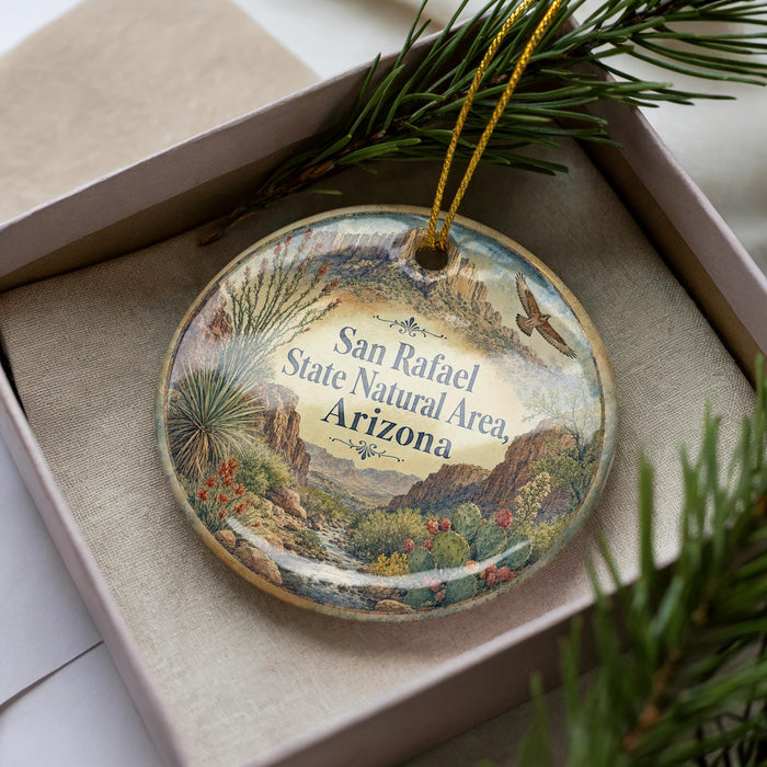 A decorative ornament in a box, featuring a scenic landscape of the San Rafael State Natural Area in Arizona.