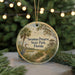 A round ornament with a scenic image of Savannas Preserve State Park, Florida, featuring a bird, palm trees, and a path.