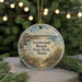 A round ornament with a lighthouse and beach scene, featuring text that says "Scarborough Beach State Park, Maine".