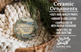 Ceramic ornaments, specifically a round ornament with a scenic image of Shackford Head State Park, Maine, hanging from a wicker basket.