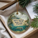 A decorative ornament with a scenic image of Silver Springs State Park, Florida, featuring a manatee, a bird, and a boat on a lake.
