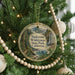 A round ornament hanging on a Christmas tree, featuring a scenic image of Sinkone Wilderness State Park, California.
