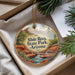 A decorative ornament with a scenic image of Slide Rock State Park, Arizona, hanging from a string.
