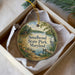 A round ornament with a scenic image of Smallwood State Park, Maryland, hanging from a string.