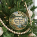 A round ornament hanging on a Christmas tree, featuring a scenic image of Smallwood State Park, Maryland.