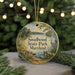 A circular ornament with a scenic landscape of Smallwood State Park, Maryland, featuring a lake, trees, and a bird, is displayed against a blurred background of Christmas lights.