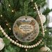 A round ornament hanging on a Christmas tree, featuring a scenic landscape of Sonoita Creek in Arizona.