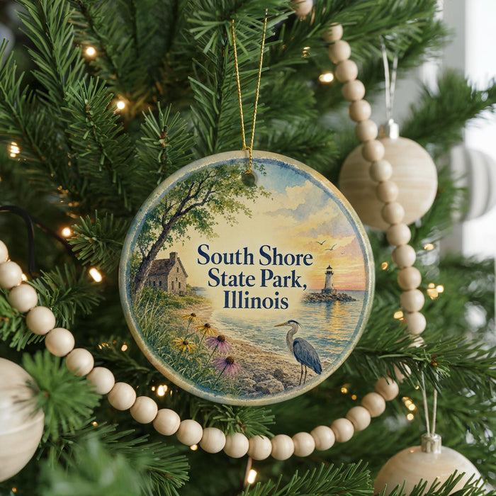 A round ornament hanging on a Christmas tree, featuring a scenic image of South Shore State Park, Illinois.