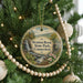 A round ornament hanging on a Christmas tree, featuring a scenic image of Stratton Brook State Park in Connecticut.