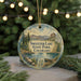 A round ornament with a scenic landscape of Switzer Lake, State Park, and Colorado, featuring a lake, mountains, pine trees, and a boat on the water.
