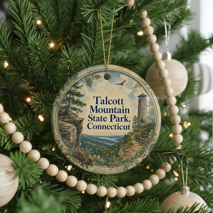 A Christmas tree decorated with ornaments, including a circular ornament with a scenic image of Talcott Mountain State Park, Connecticut.