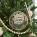 A Christmas tree decorated with ornaments, including a circular ornament with a scenic image of Talcott Mountain State Park, Connecticut.