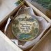 A decorative ornament in a box, featuring a scenic image of Tarpon Springs, Heritage State Park, Florida.