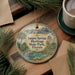 A decorative ornament featuring a scenic image of Tarpon Springs Heritage State Park, Florida, with a cup of coffee and pine branches in the background.