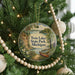 A round ornament on a Christmas tree, featuring a scenic image of Twin Lakes State Park in Michigan.