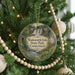 A round ornament hanging on a Christmas tree, featuring a scenic image of Wadsworth Falls State Park in Connecticut.