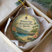 A circular ornament with a tropical beach scene and a pier, featuring the text "Waihee State Recreation Pier, Hawaii" and a small illustration of a palm tree.