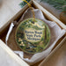 A round ornament with a scenic image of Warren Woods State Park, Michigan, displayed in a box.