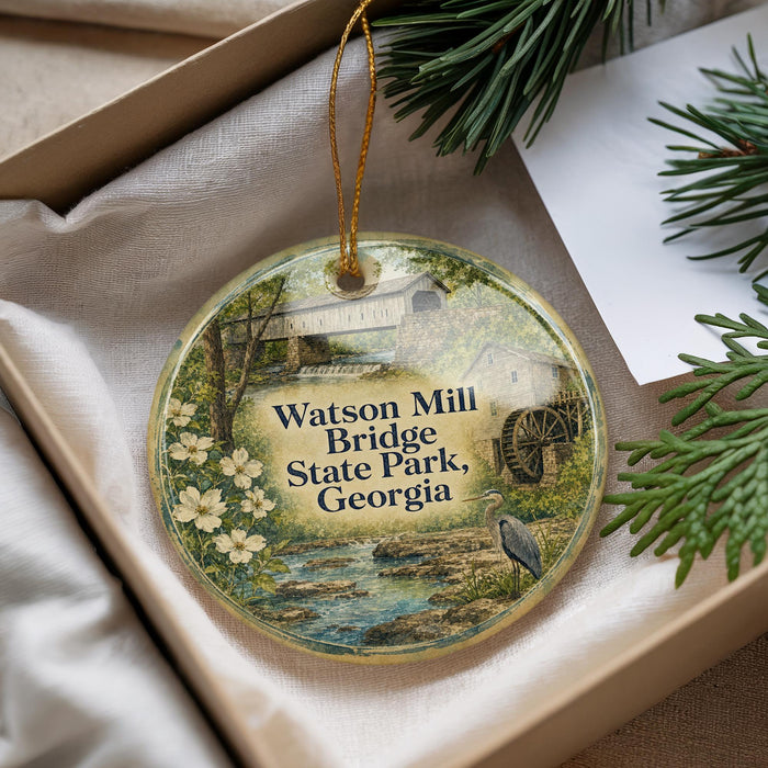 A round ornament with a scenic image of Watson Mill Bridge, State Park, Georgia, hanging from a string.