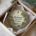 A round ornament with a scenic landscape of Webster State Park, Kansas, displayed in a box.