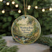 A circular ornament with a scenic landscape of a waterfall and a house, surrounded by greenery, is displayed in front of a blurred background with twinkling lights.