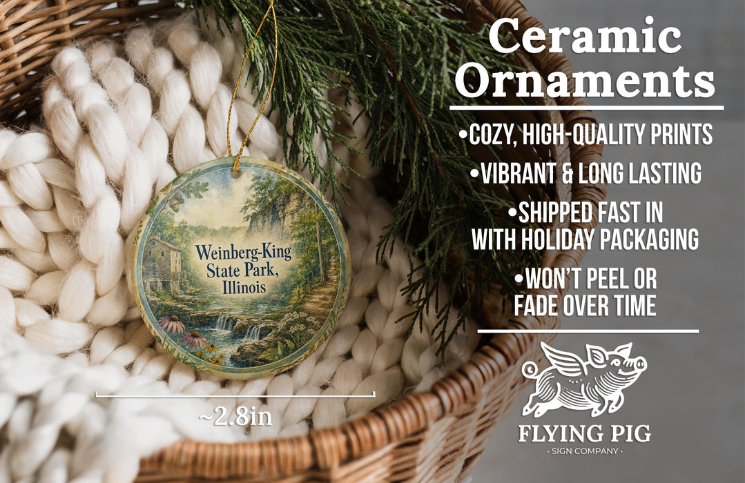 Ceramic ornaments, including a round ornament with a scenic view of Weinberg-King State Park, Illinois, hanging from a wicker basket.