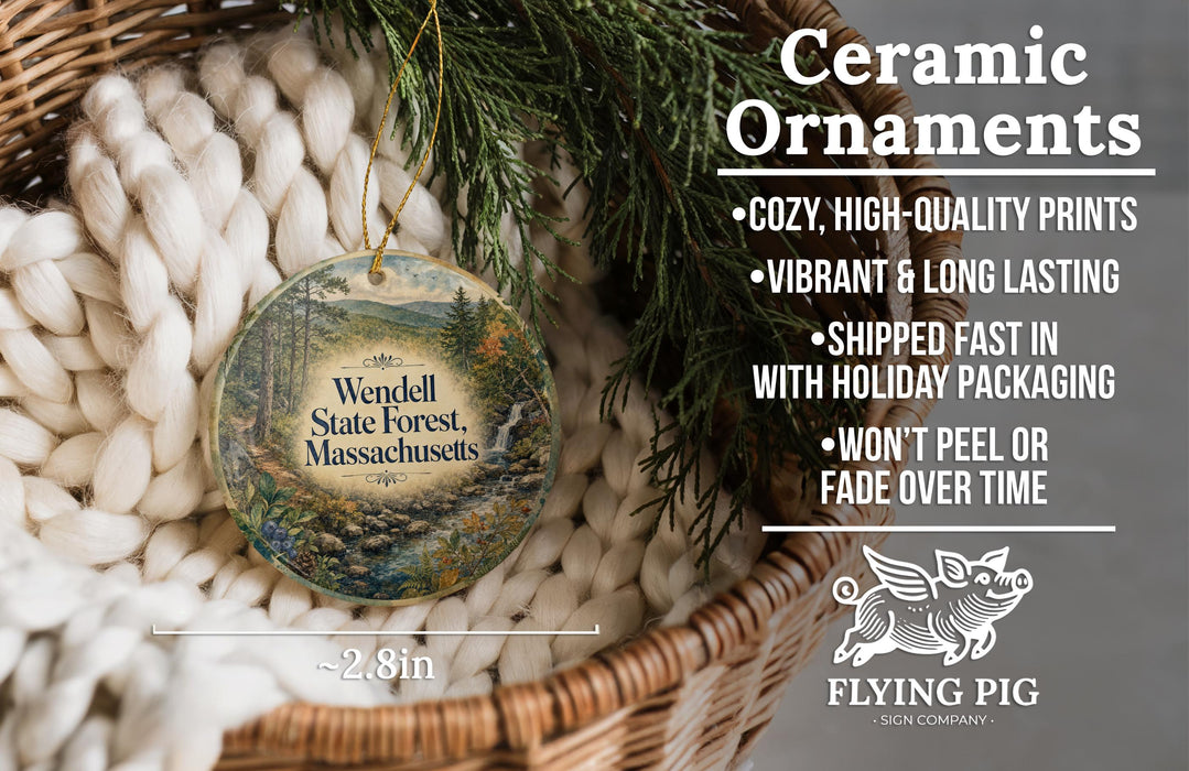 Ceramic ornaments, featuring a scenic image of Wendell State Forest, Massachusetts, hanging from a wicker basket.