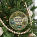 A round ornament hanging on a Christmas tree, featuring a scenic image of a pond and wildlife, with the text "Werner-Boley Salt Springs State Park, Florida" displayed on it.