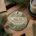 A decorative ornament with a house illustration and the text "White Hall State Historic House, Kentucky" is displayed on a wooden surface, accompanied by a cup of coffee and pine branches.